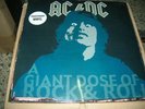 AC / DC    a giant dose of rock   LP  clear vinyl