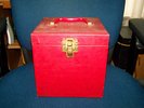 Record case with several 45's including Elvis Presley's Jailhouse Rock