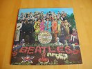 Beatles Sgt. Pepper Album with cut out sheet.
