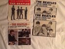 Two 45 rpm Beatles records with jackets plus two jackets from the mid 1960's