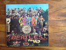 The Beatles Lonely Hearts Sgt peppers club band LP with cut outs (not cut)