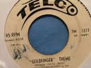 SILVER STRINGS COMBO - goldfinger theme b/w brown skin girl - TELCO
