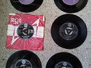 Six Elvis Presley singles including All Shook Up and Hound Dog on purple labels.