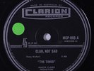 TIMES: Glad, Not Sad / Woman Love 45 (Australia, playable storage warp, sm tol)