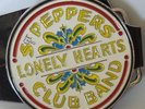 THE BEATLES : SGT PEPPERS LONELY HEARTS CLUB BAND LOGO BELT BUCKLE.  (TK)