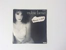 45t MYLÈNE FARMER.   MAMAN A TORT .  POCHETTE NOIR ET BLANC
