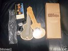 THE BEATLES APPLE TIMEPIECE WATCH WITH WOODEN GUITAR CASE AND CARDBOARD BOX FAB