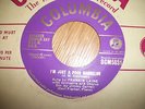 FRANKIE LAINE--I,M JUST A POOR BACHELOR/TONIGHT YOU BELONG TO ME---NR MINT