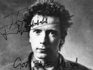 AUTHENTIC JOHNNY ROTTEN PISTOLS PILL SIGNED 12 X 8 PHOTO..REAL SIGNATURE..COA