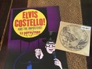 Elvis Costello. Autographed Tour Poster, Sealed Single, VIP Pass and 2nd poster.