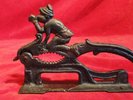 GREAT ANTIQUE IRON NUTCRACKER WITH PIED PIPER/PETER PAN RIDING BIRD
