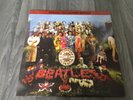 The Beatles “Sgt Pepper” Special Collectors Edition Yellow Vinyl LP.
