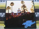 THE EAGLES HOTEL CALIFORNIA 7E1084 1976 W/SLV & POSTER EX