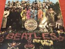 The Beatles Sgt. Pepper’s UK Mono First Pressing Wide Spine LP.