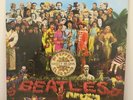 Beatles - SGT Peppers Lonely Hearts Club Band -Vinyl Lp with cut out card.
