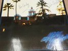 THE EAGLES . FULLY SIGNED VINYL ALBUM . HOTEL CALIFORNIA .In very nice condition