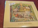GENESIS SELLING ENGLAND BY THE POUND LP SEALED CIRCULAR PUNCH HOLE PROMO?