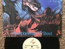 Exxplorer - Symphonies of Steel LP Metal Blade 86 Iron Maiden Exciter Saxon Doro