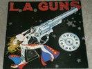 L.A.GUNS  COCKED & LOADED  USED  UK & EUROPE 33rpm LP  ORANGE VERTIGO LABEL  VG+