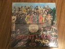 The Beatles “Sgt. Pepper” sealed U.K. early 1980’s stereo Lp pressing Minty cond