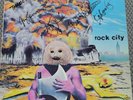 Riot    ROCK CITY      autographed  in 1980      1977 album