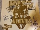 KISS KRUISE SIGNED ROCK AND ROLL ALL NITE VINYL - VINYL NEAR MINT COVER DAMAGED.