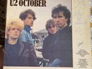 'October' Vinyl Signed and Dated by all of U2 on 14th October 1981 at Top Rank