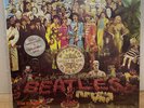 the Beatles Sgt. Peppers lonely hearts club band. Red Vinyl